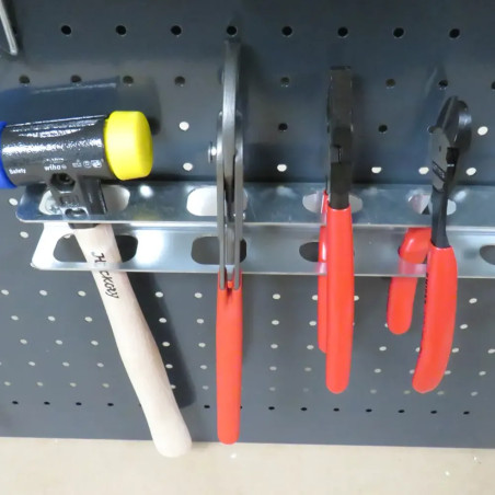 Support pour outils pour fond perforé