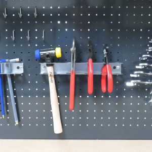 Support pour outils pour fond perforé