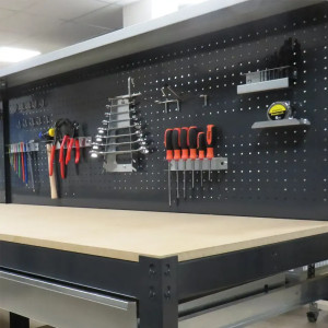 Support pour outils pour fond perforé